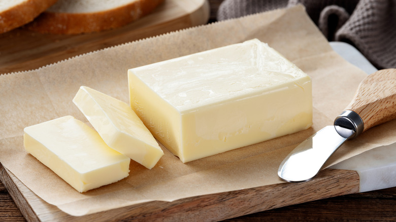 sliced butter on wood board