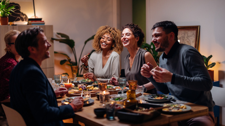 A group of friends eating at a table