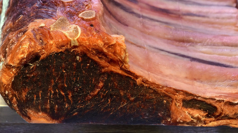 A dry-aged rib roast showing a deep red color.
