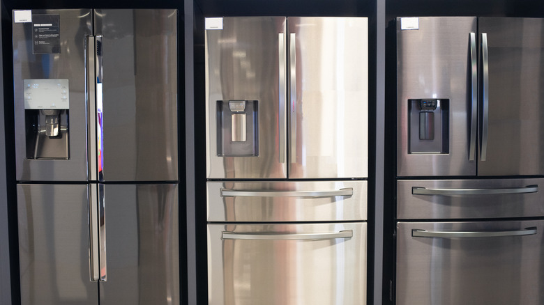 Three new fridges on display in store.