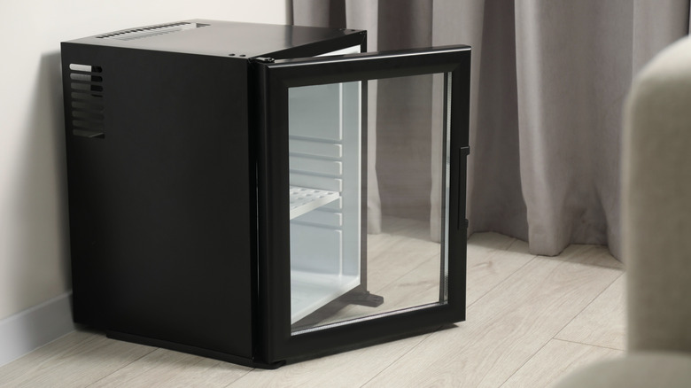 empty mini fridge with door open