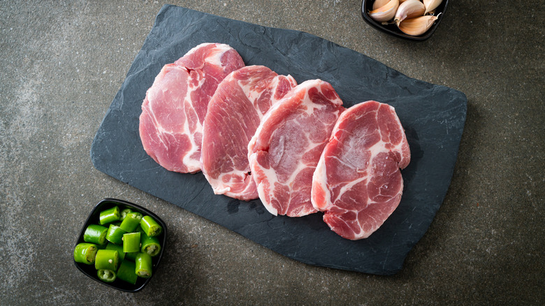 Boneless pork chops on a kitchen countertop