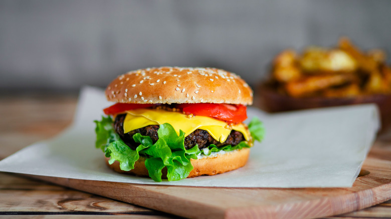 Burger with cheese, tomatoes, lettuce