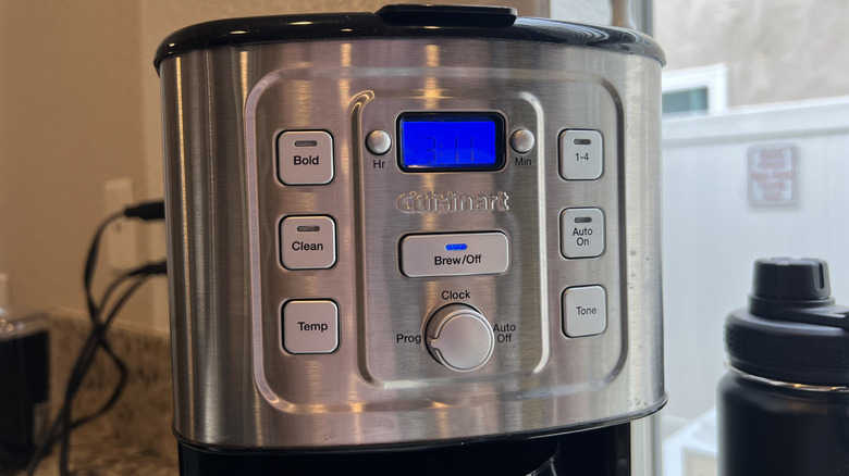Closeup of Cuisinart coffee maker with various different function buttons, including a button labelled clean