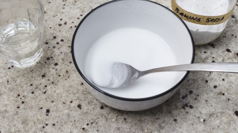 Paste of baking soda and water in bowl