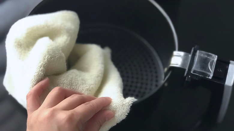 hand cleaning air fryer with soft cloth