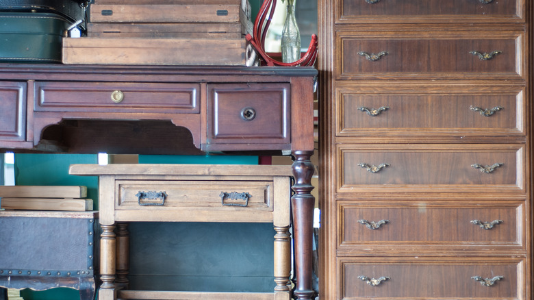 Several old tables and drawers stacked together