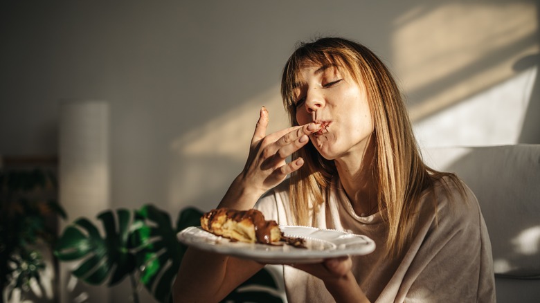 woman eating a croissant