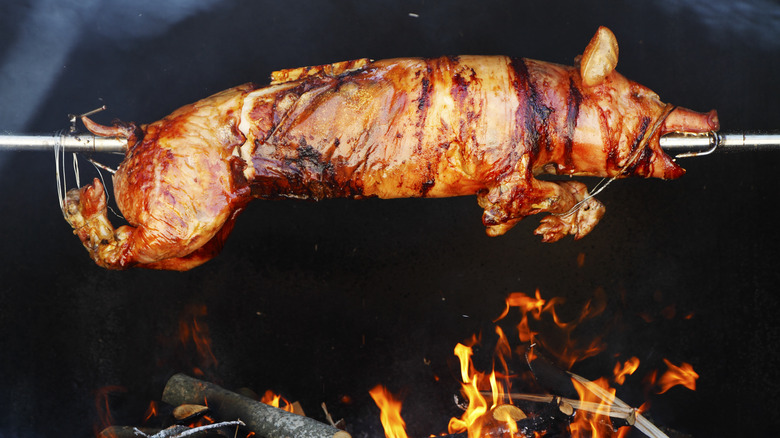 pig roasting on a spit