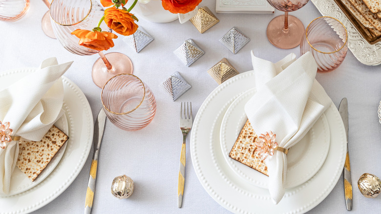 Passover tablescape with a similar style of folded napkin