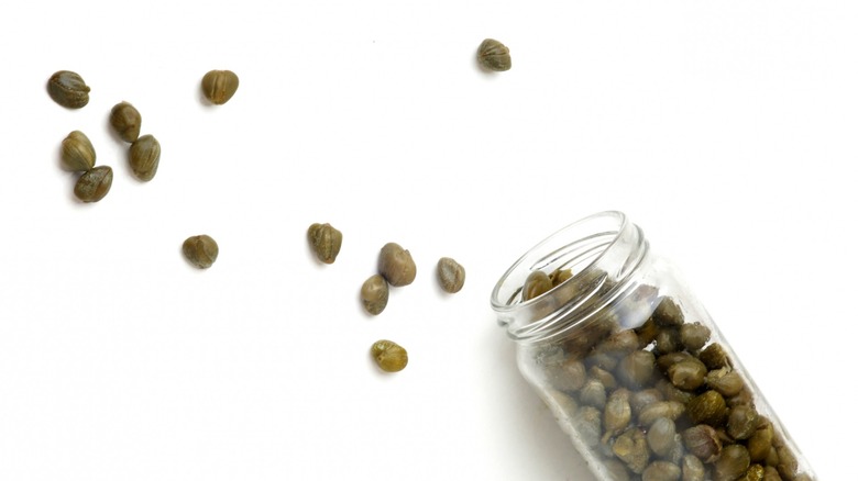 Capers falling out of jar