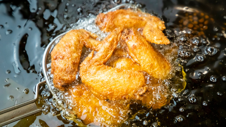 Japanese fried chicken boiling in hot oil