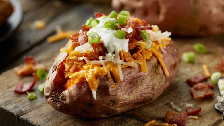 loaded baked potato with bacon cheese sour cream and chives