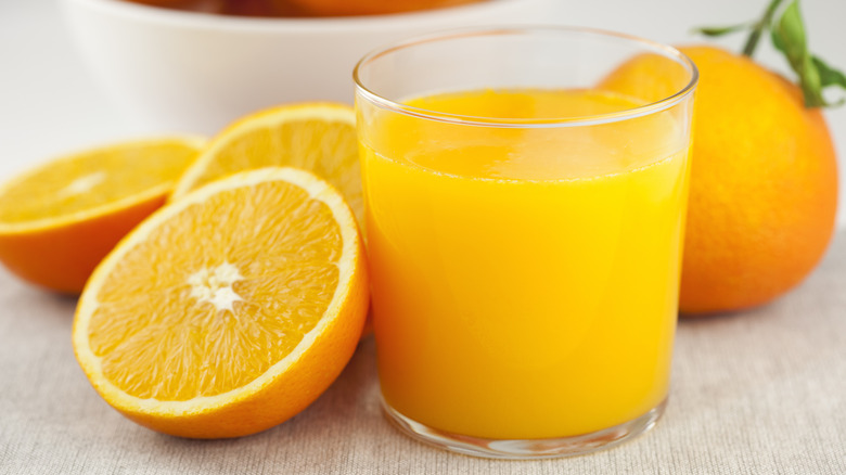 halved oranges and orange juice