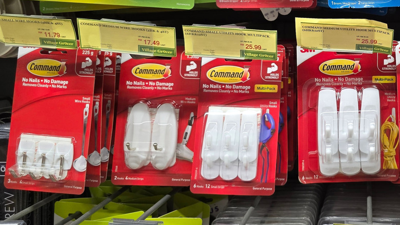 packages of plastic command hooks on a store shelf