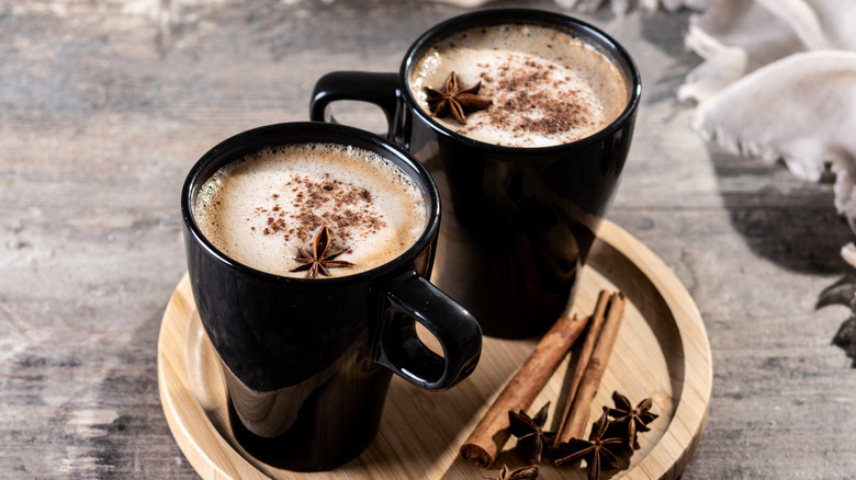 chai latte mugs displayed with spices