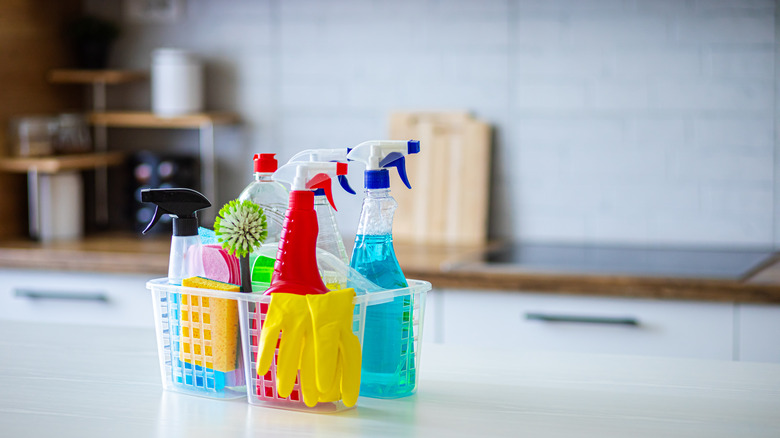 Plastic caddy of cleaning products on a kitchen counter