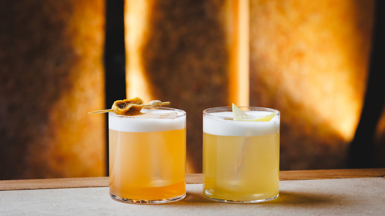 Two glasses of whiskey sour