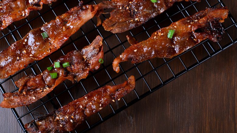 Crispy maple bacon left on a roasting tray