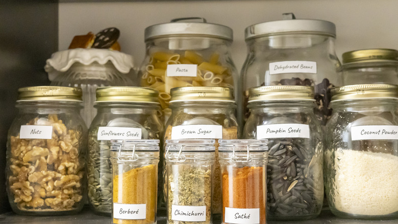 Clear glass jars in a pantry
