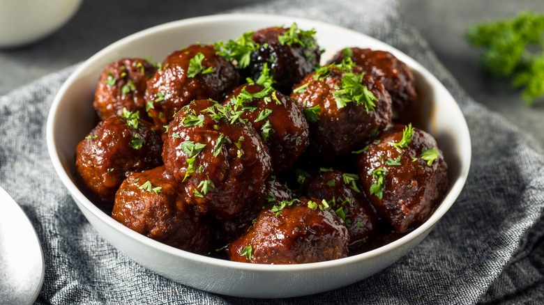 meatballs in sauce with herbs