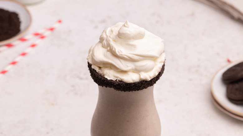 Oreo milkshake topped with whipped cream