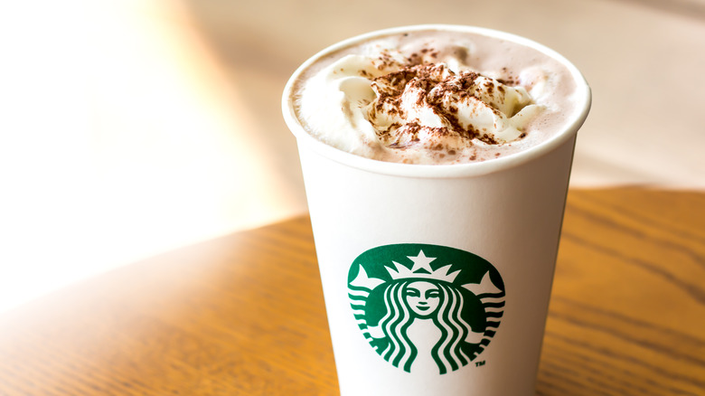 Starbucks cup topped with cinnamon 
