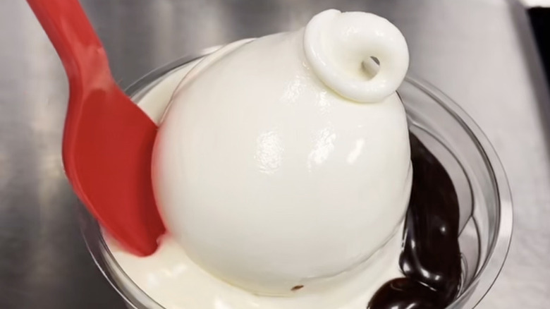 A Dairy Queen Jack and Jill sundae is in a cup.