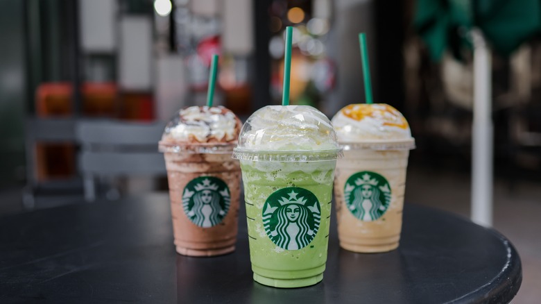 three starbucks drinks on a table