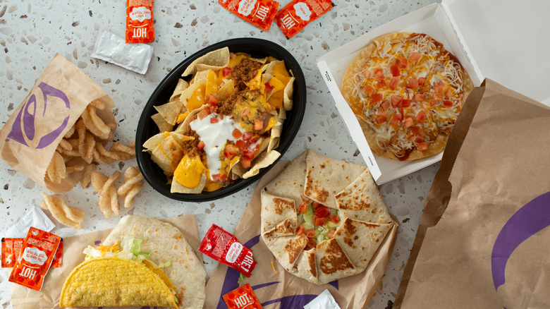 Taco Bell combo meal with nachos, tacos, and Mexican pizza