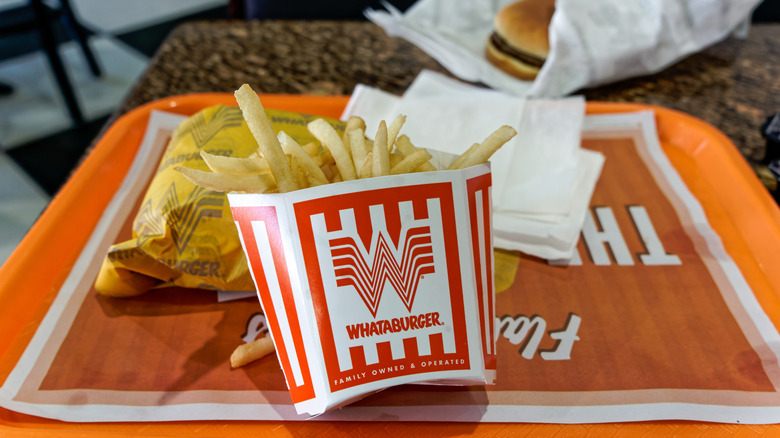 Whataburger fries and burgers on tray