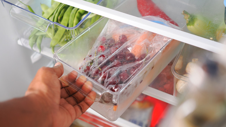 A fridge organized with plastic containers