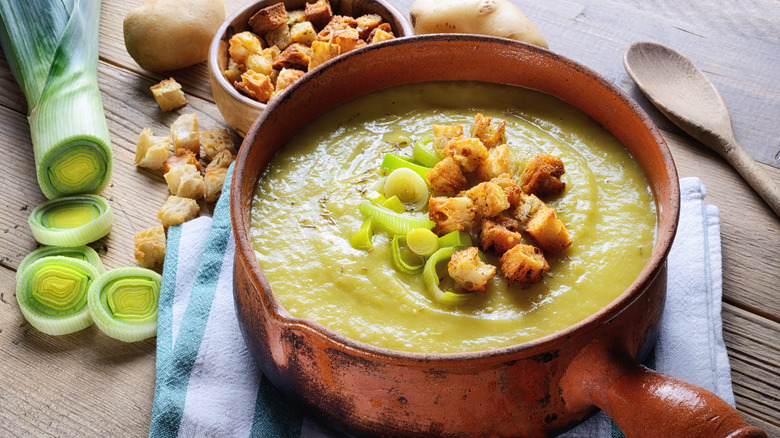 Potato leek soup in a pot with ingredients