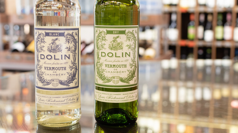 bottles of French vermouth Dolin Blanc and Dry on bar top
