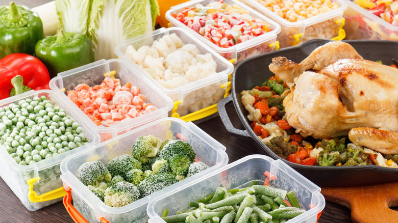 roasted chicken with containers of frozen vegetables