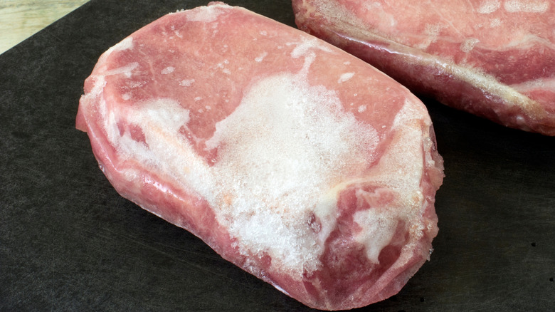 A pork chop with freezer burn