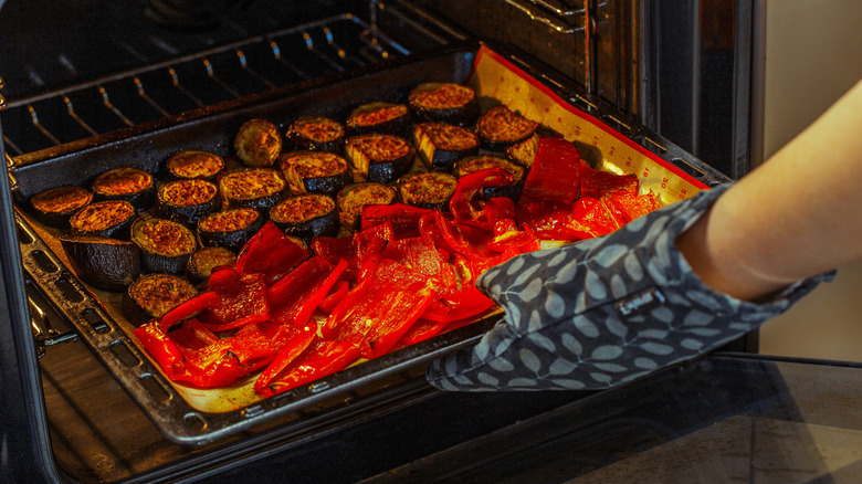 removing broiled vegetables from oven