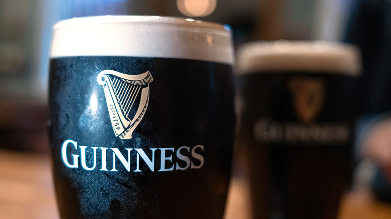 A close up of two pints of Guinness