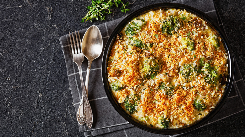 Cheesy, crispy-topped chicken and broccoli casserole in round baking dish.