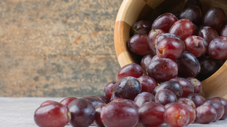 Grapes spilling from bowl