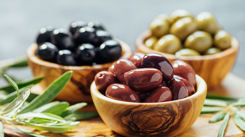 Bowls of different colored olives