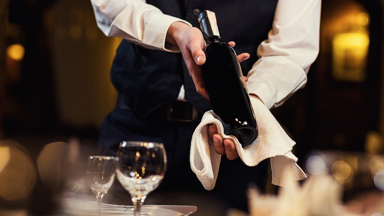 Waiter showing a wine bottle