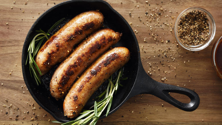 Cooked sausages in cast iron