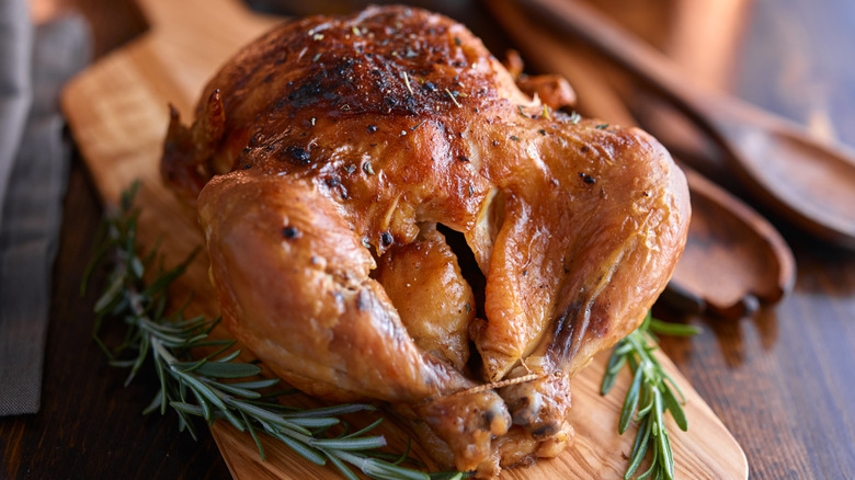 rotisserie chicken on wood board