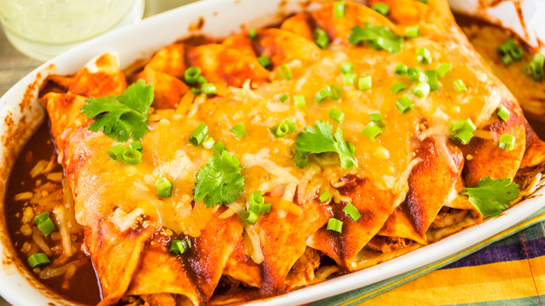 dish of enchiladas made with crispy rotisserie chicken