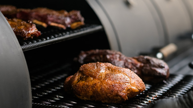 smoked meat on barbecue grill