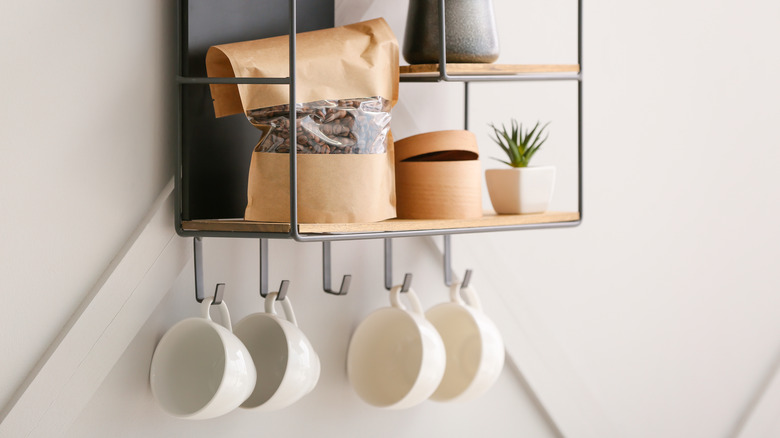 Mugs hanging on a kitchen wall