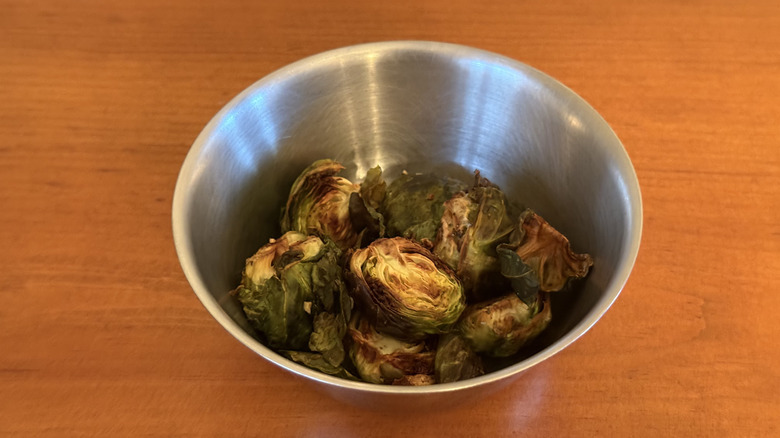 Stainless steel bowl with air fried Brussels sprouts