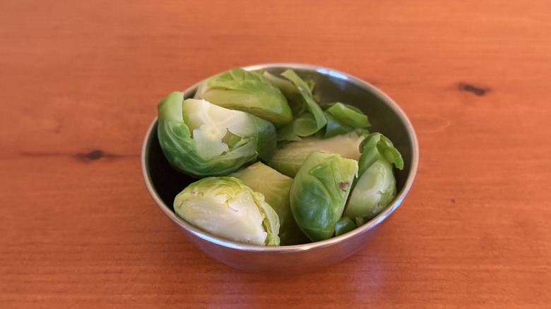 Stainless steel bowl with boiled Brussels sprouts