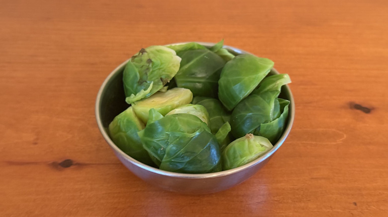 Stainless steel bowl with microwaved Brussels sprouts